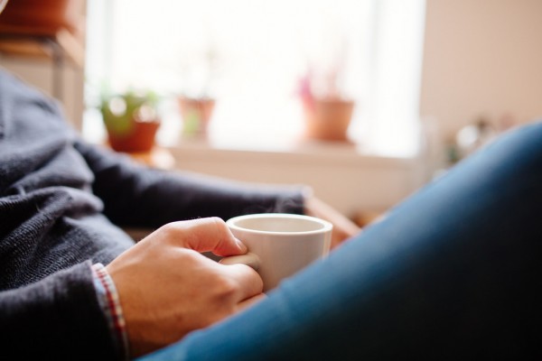 Man Drinking Coffe in Cozy Room